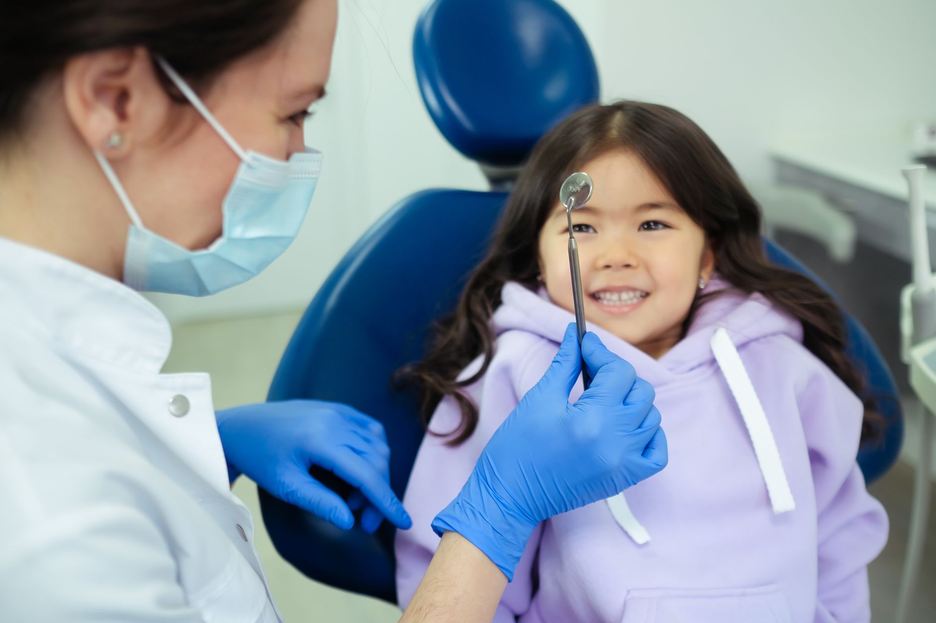 friendly dentist with patient